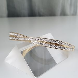 Swarovski Edith Goldtone Twist Rows Pave Hinged Bracelet